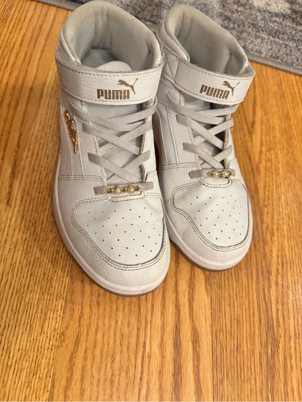 Puma Kids White Mid-Top Sneakers with Gold Accents